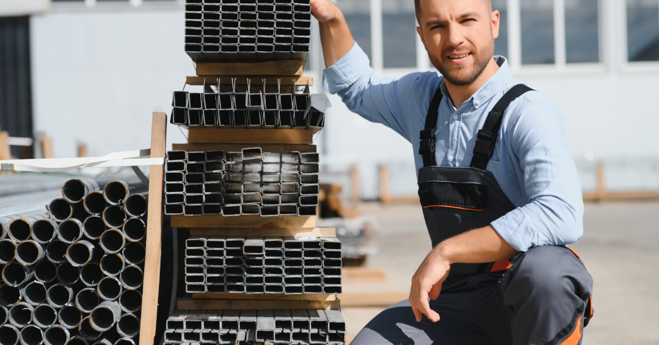 Portrait of factory worker. Young handsome factory worker.
